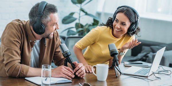 Two people conducting a podcast